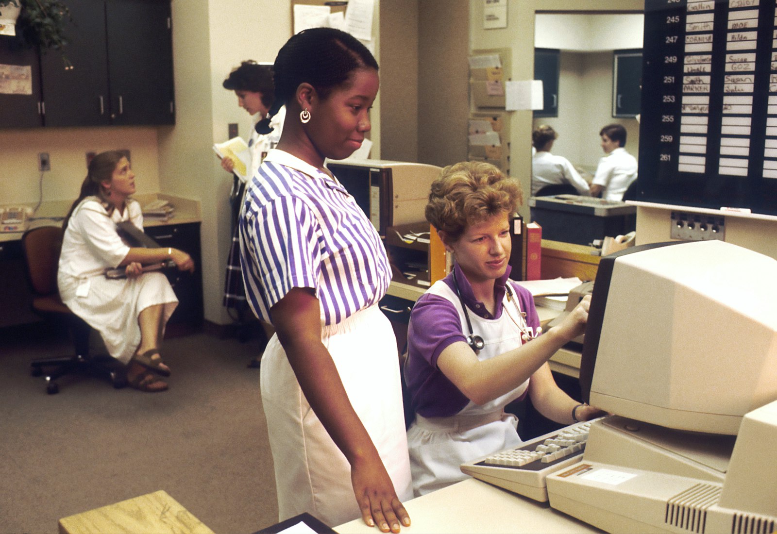Nurse charting between patients.