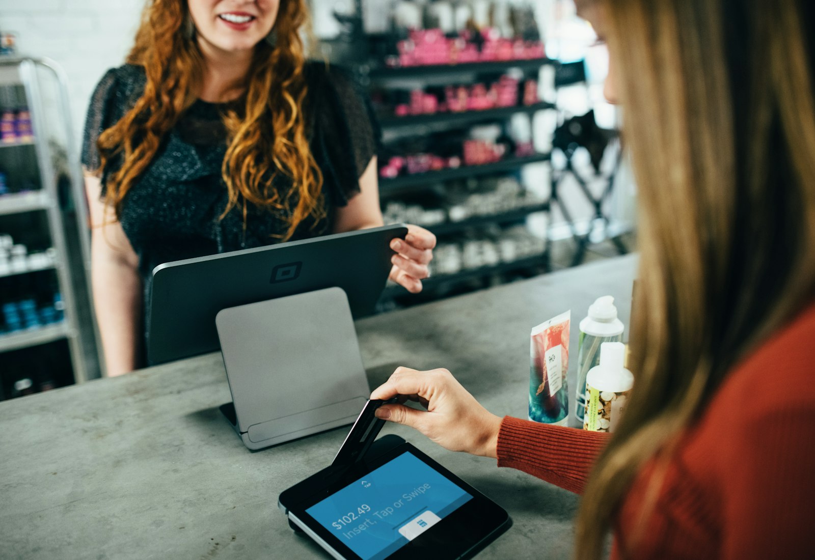 Retail manager on tablet.